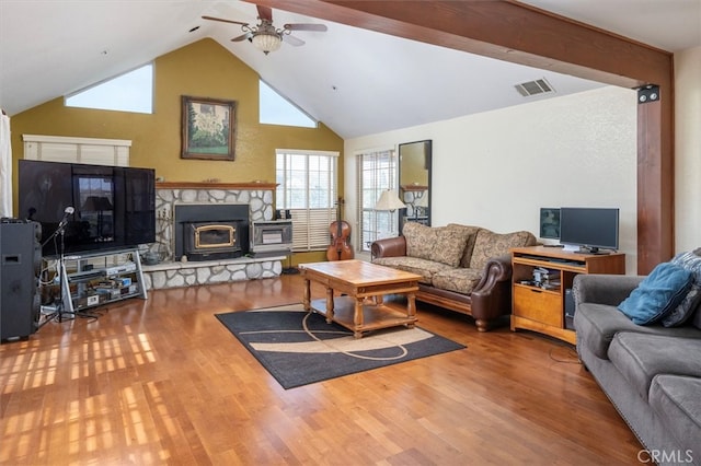 living room with ceiling fan, beam ceiling, high vaulted ceiling, a fireplace, and hardwood / wood-style floors