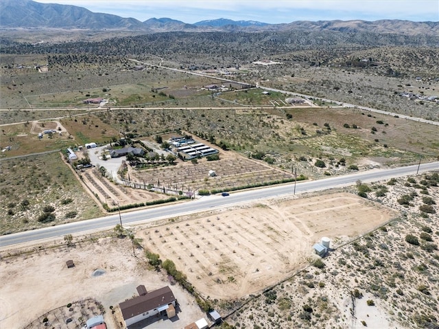 drone / aerial view with a mountain view and a rural view