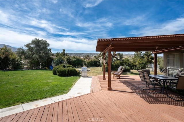 wooden deck with a lawn