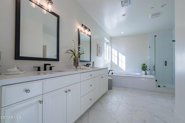 bathroom featuring separate shower and tub and vanity