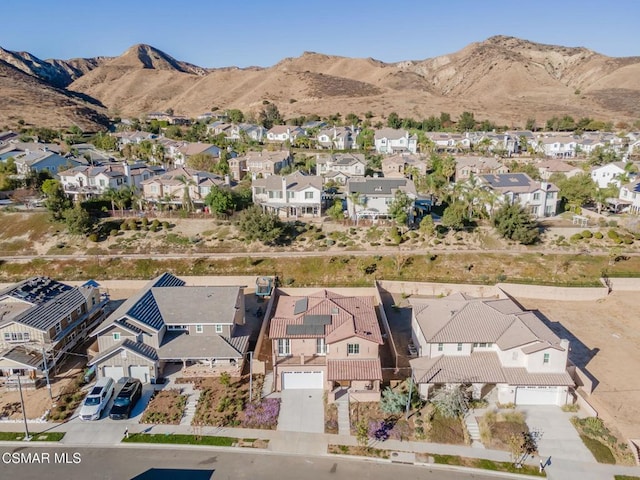 birds eye view of property with a mountain view