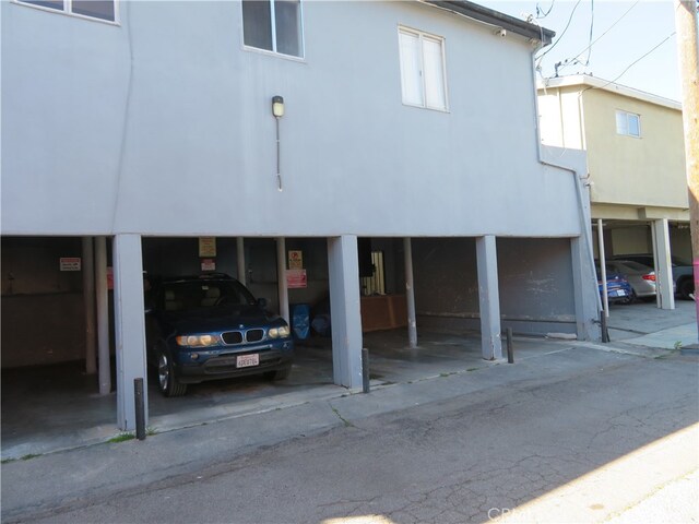 back of property featuring a carport