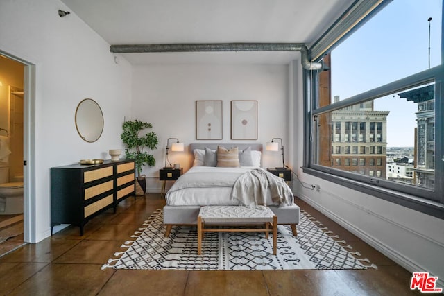 bedroom featuring beam ceiling