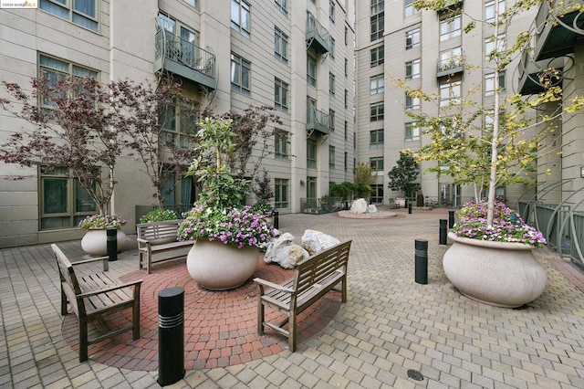 view of patio with an outdoor hangout area and a balcony