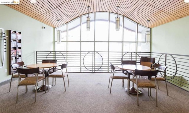 sunroom featuring wood ceiling, a wealth of natural light, and lofted ceiling