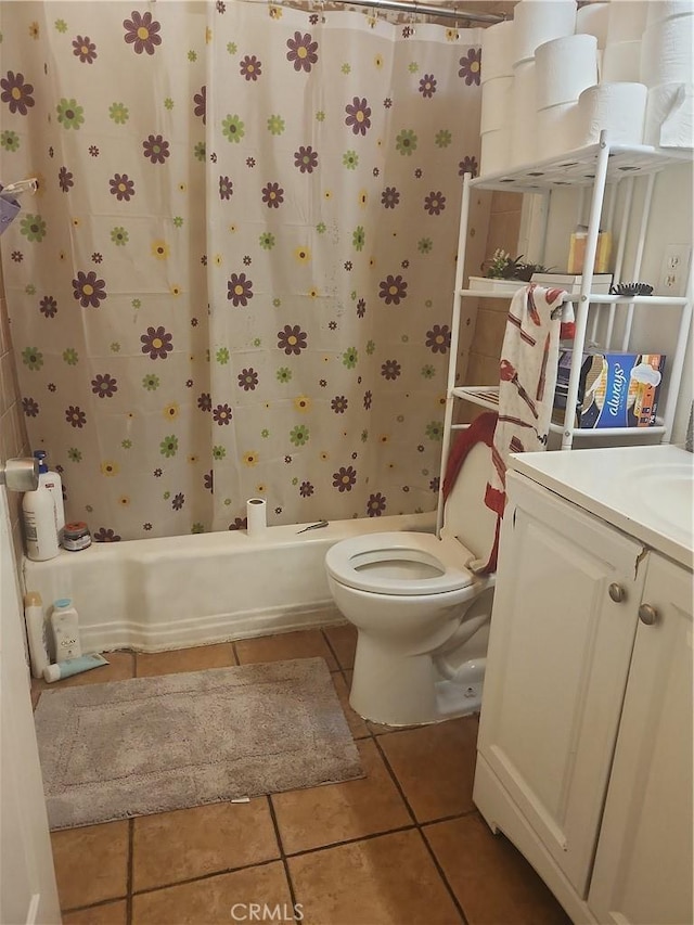 full bathroom featuring toilet, vanity, shower / tub combo, and tile patterned floors