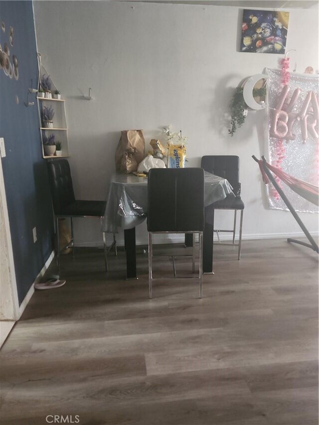 dining space featuring hardwood / wood-style floors