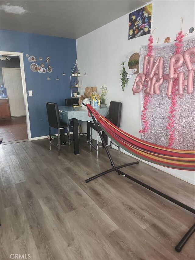 dining room with hardwood / wood-style flooring