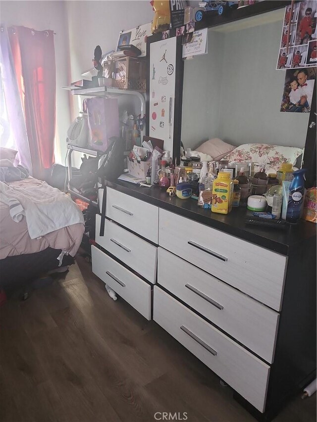 bedroom featuring dark wood-type flooring