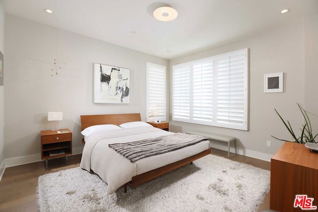 bedroom featuring dark hardwood / wood-style flooring