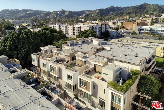 birds eye view of property with a mountain view