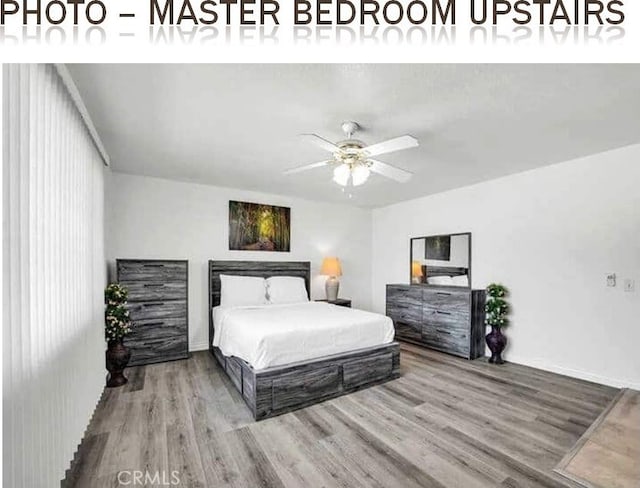 bedroom featuring wood finished floors