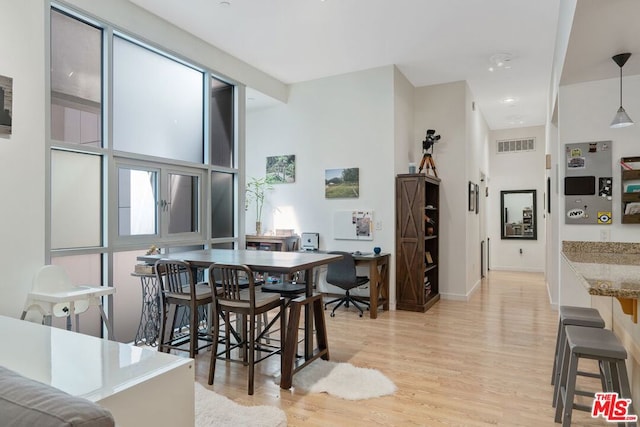 dining area with light hardwood / wood-style flooring