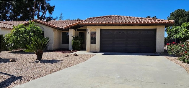 mediterranean / spanish-style house featuring a garage