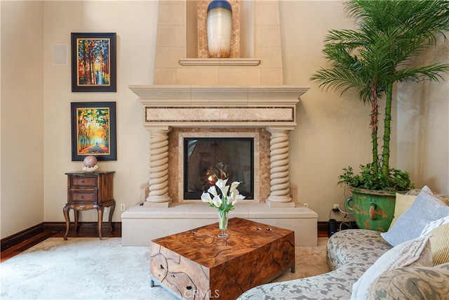 sitting room with a tile fireplace