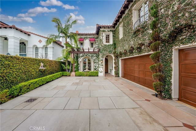 mediterranean / spanish house with a garage