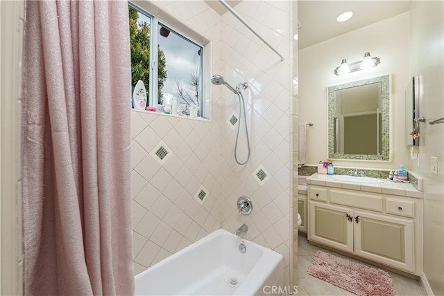 bathroom featuring shower / bath combo with shower curtain, vanity, and tile patterned flooring