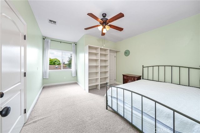 bedroom featuring ceiling fan and light carpet