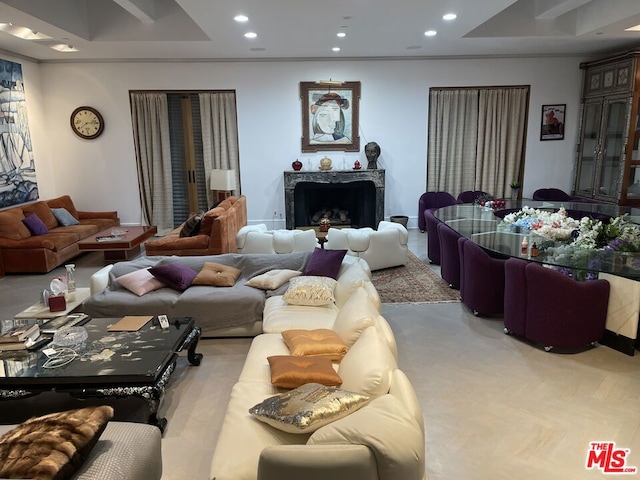 living room with a premium fireplace and light parquet flooring