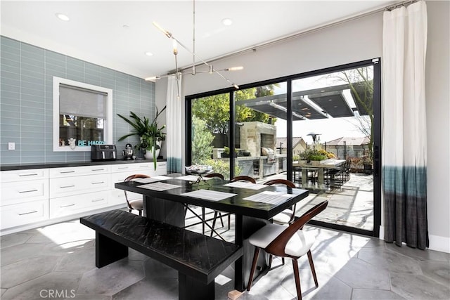 dining room featuring tile walls