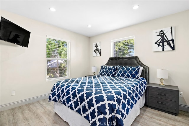 bedroom with light hardwood / wood-style flooring