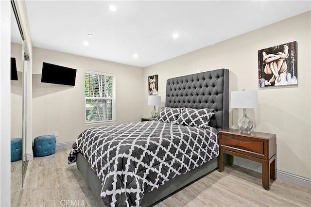 bedroom with hardwood / wood-style floors