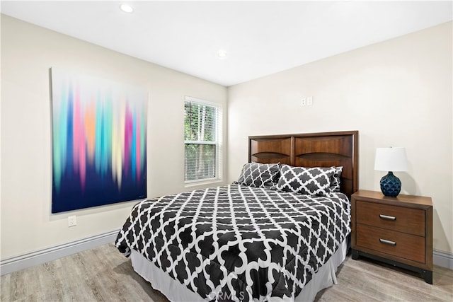 bedroom with light wood-type flooring