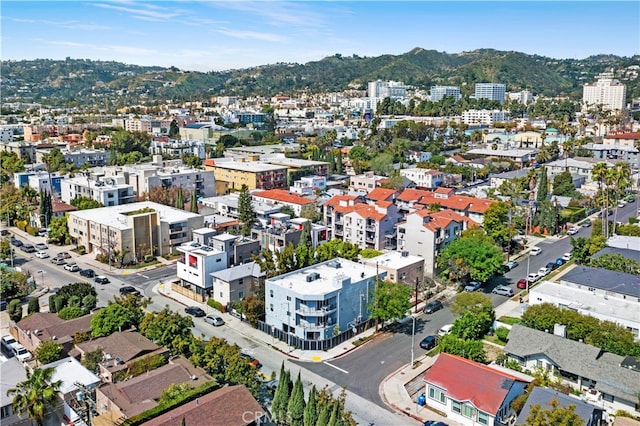 birds eye view of property with a mountain view