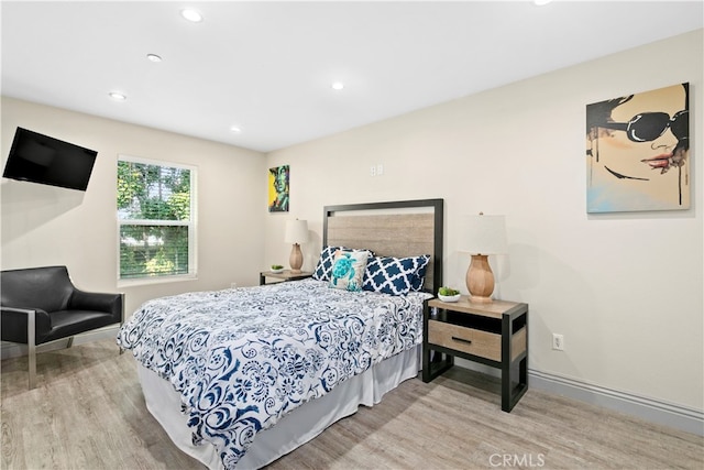 bedroom with light hardwood / wood-style flooring