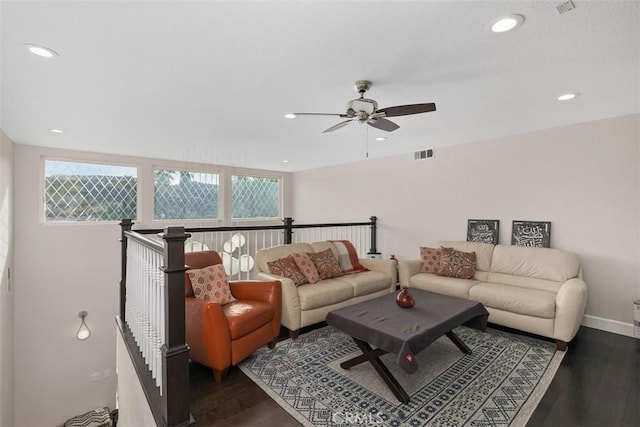 living room with ceiling fan, a healthy amount of sunlight, and dark hardwood / wood-style flooring