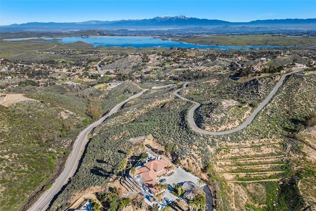 bird's eye view with a water and mountain view