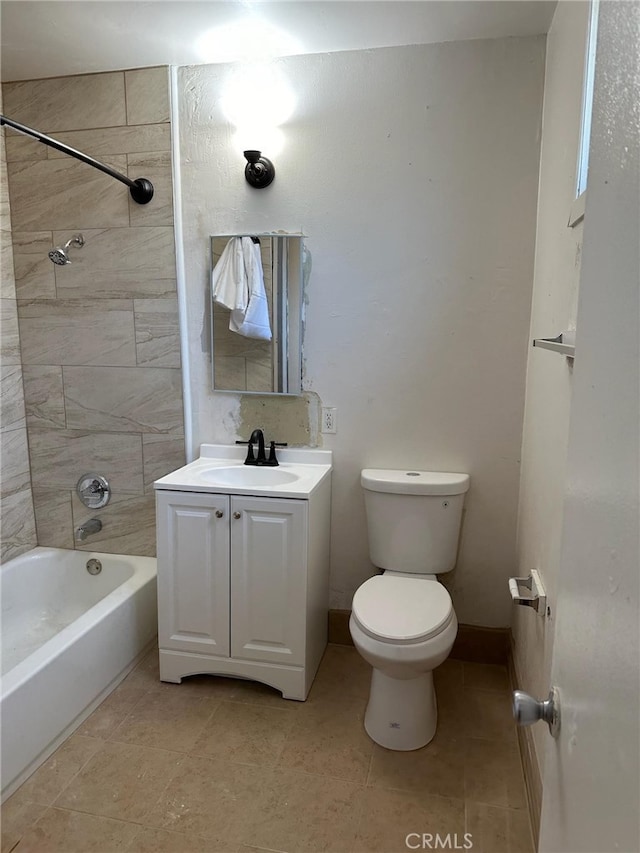 full bathroom featuring tiled shower / bath combo, tile patterned flooring, vanity, and toilet