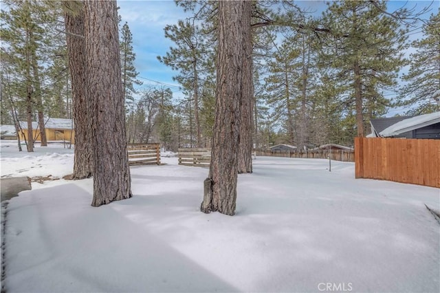 view of yard layered in snow