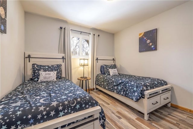 bedroom with hardwood / wood-style flooring