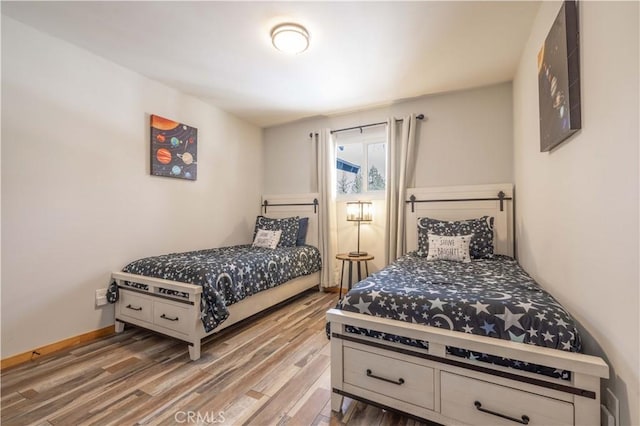 bedroom featuring wood-type flooring