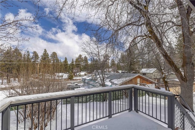 view of snow covered deck