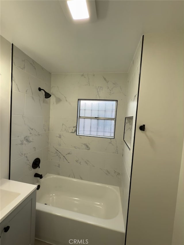 bathroom featuring vanity and shower / tub combination