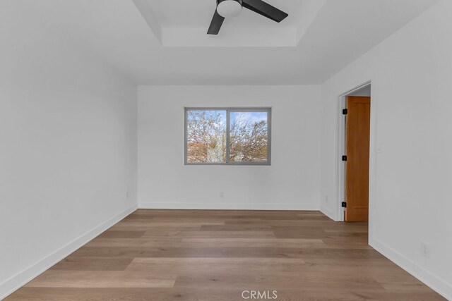 unfurnished room with light hardwood / wood-style flooring and ceiling fan