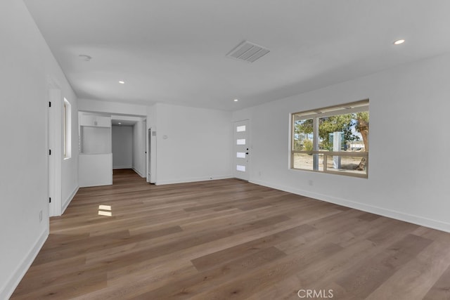 spare room featuring light wood-type flooring