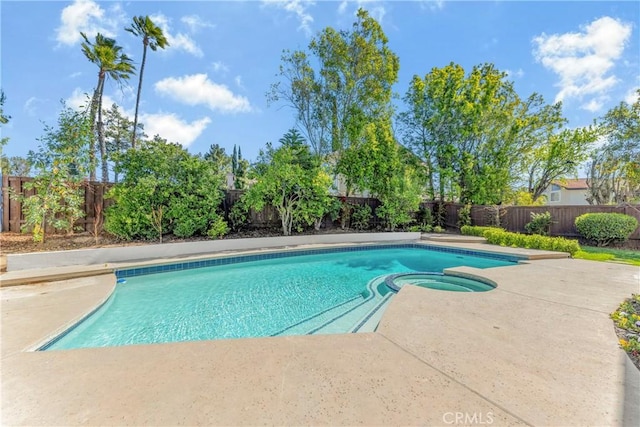 view of pool featuring an in ground hot tub and a patio