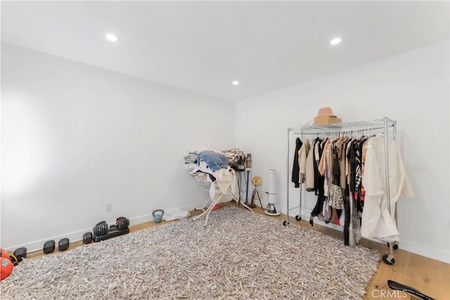 workout area featuring hardwood / wood-style floors