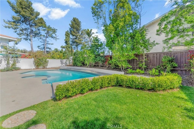 view of pool with a lawn