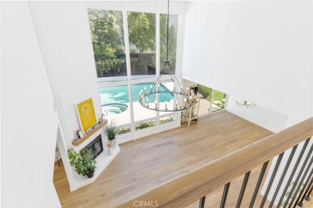 interior space featuring hardwood / wood-style floors, a wealth of natural light, and a chandelier