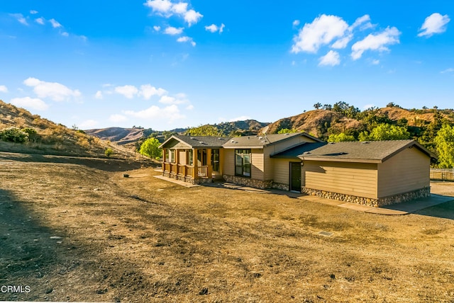 exterior space featuring a mountain view