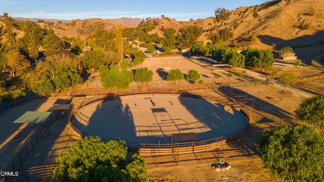 birds eye view of property featuring a mountain view and a rural view