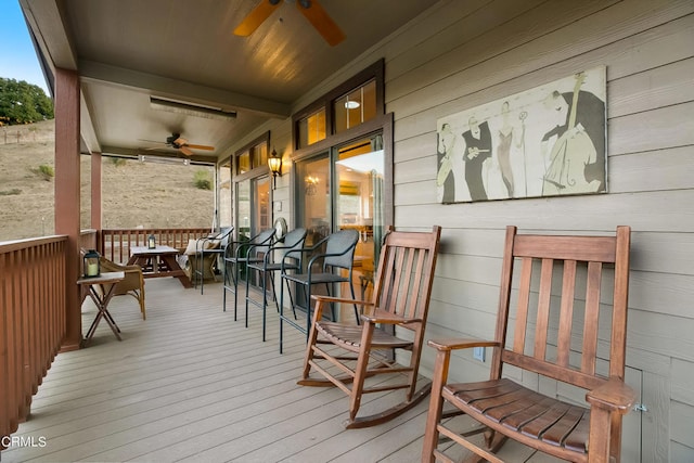 wooden deck with ceiling fan