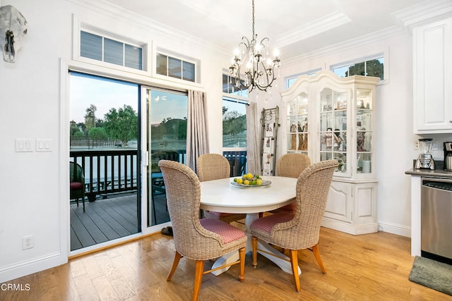 dining area with a notable chandelier, a wealth of natural light, and light wood-type flooring