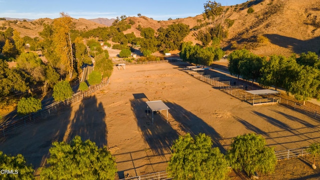 birds eye view of property featuring a rural view and a mountain view