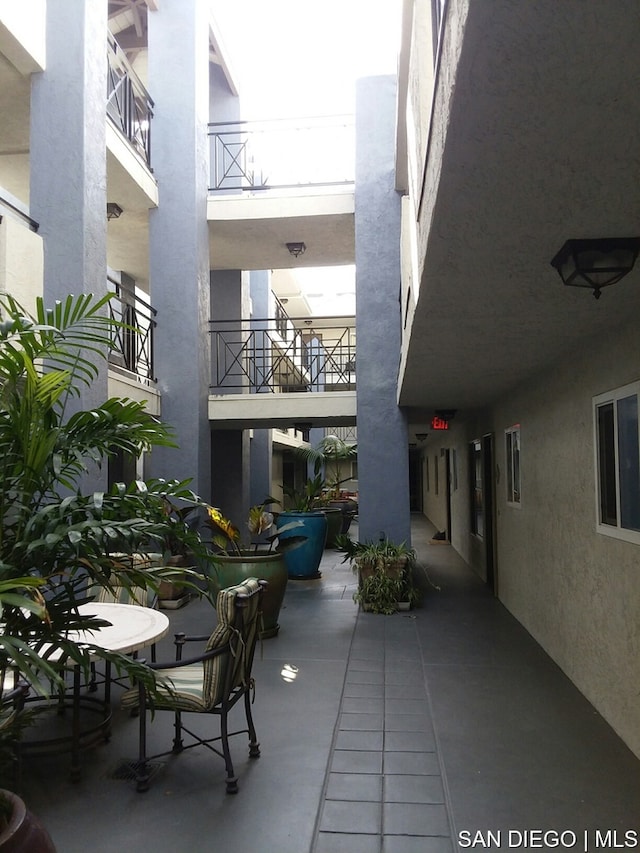 view of patio with a balcony