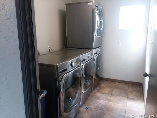 clothes washing area featuring stacked washer and clothes dryer